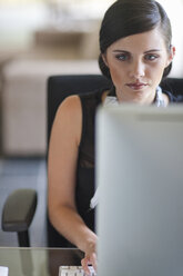 Young office worker using computer - CUF33593