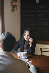 Elegant couple talking in a cafe - ALBF00547