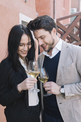 Elegant affectionate couple drinking wine in the city - ALBF00560