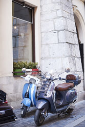 Two old motor scooters parking in front of a house - ABIF00640