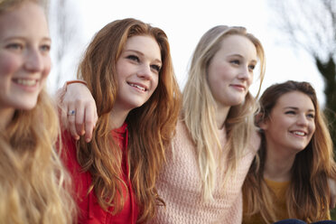 Four teenage girlfriends posing for portrait - CUF33787