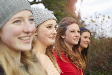 Close up of four teenage girls outdoors - CUF33791