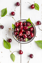 Bowl of cherries on white wood - SARF03798