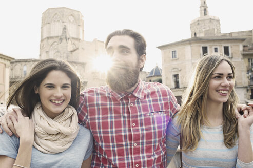 Three young tourists, Plaza de la Virgen, Valencia, Spain - CUF34007