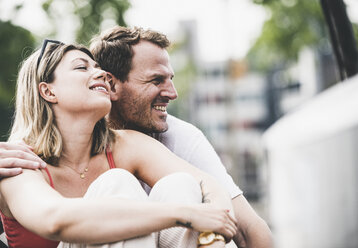 Happy couple relaxing outdoors - UUF14292