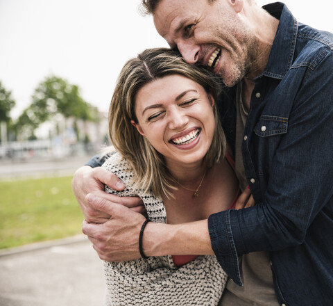 Happy couple having fun outdoors stock photo