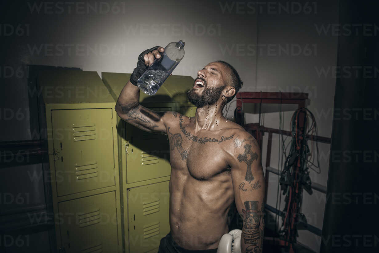 Personal Trainer with a Tattooed Body Does the Workout in the Gym. Stock  Photo - Image of equipment, handles: 152129634