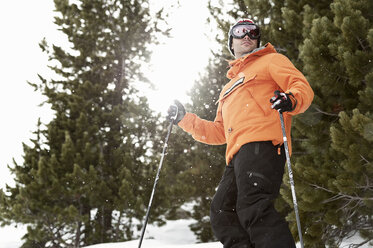 Mid adult male skier standing on mountainside, Obergurgl, Austria - CUF34076