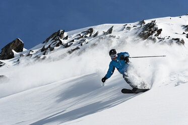 Man skiing downhill, Obergurgl, Austria - CUF34082