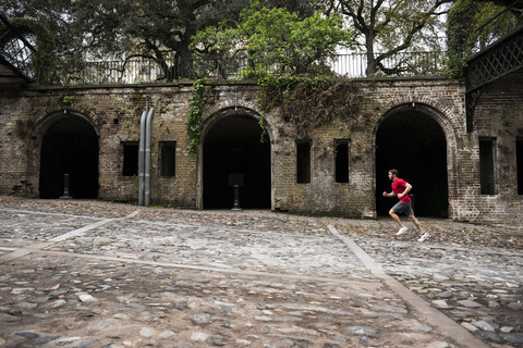 Jogger entlang der Flusspromenade, Savannah, Georgia, USA, lizenzfreies Stockfoto