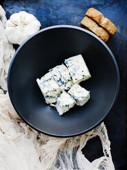 Garlic bulb and bowl of cubed blue cheese - ISF14309