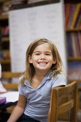 Girl smiling in classroom - ISF14407