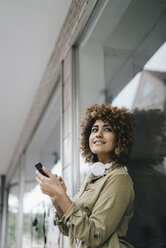 Woman in the city using smartphone - KNSF04134