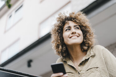 Woman in the city using smartphone - KNSF04151