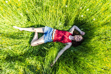 Young woman relaxing in meadow - SARF03803