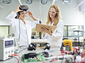 Female technicians working with tablet and vr glasses - CVF00879