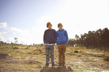 Portrait of twin brothers in forest clearing - CUF34648