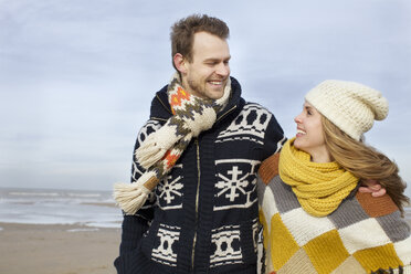 Portrait of mid adult couple strolling on beach, Bloemendaal aan Zee, Netherlands - CUF34823