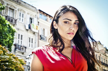 Portrait of sultry young woman on street, Cagliari, Sardinia, Italy - CUF35302