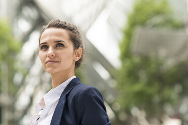 Confident young businesswoman at Broadgate Tower, London, UK - CUF35721