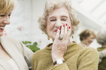 Senior woman with daughter, laughing - CUF35947