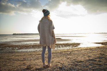 Young woman gazing on Bournemouth beach, Dorset, UK - CUF36346