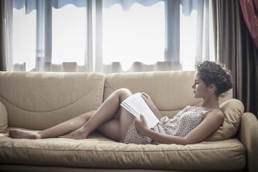 Young woman reading book - CUF36435