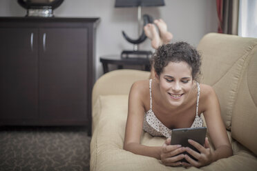 Young woman using digital tablet - CUF36439