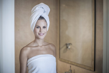 Young woman with towel on head - CUF36442