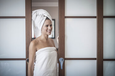 Young woman with towel on head - CUF36444
