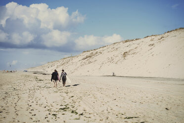 Surfers with surfboard on beach, Lacanau, France - CUF36494