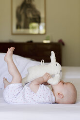 Baby girl playing with soft toy - CUF36756