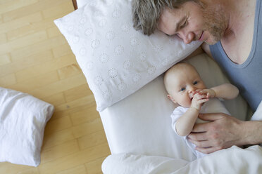 Father and baby daughter on bed - CUF36788