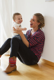 Mother playing with baby boy - CUF36872