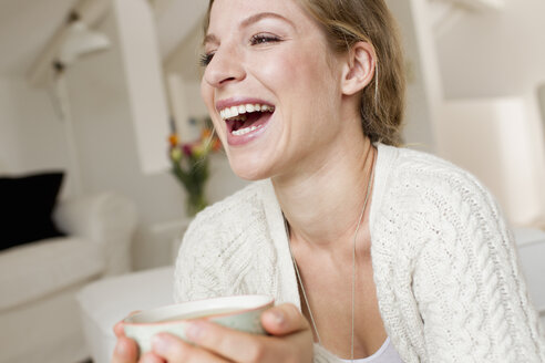 Woman drinking tea - CUF36874