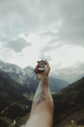 Andorra, tattooed man holding compass, partial view - OCAF00333