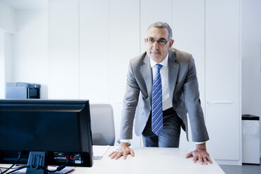 Businessman at office desk - CUF37042