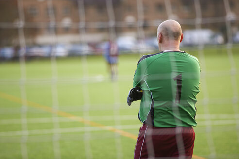 Rearview of goalie at football game - CUF37107