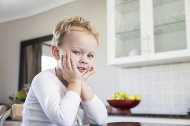 Portrait of cheeky four year old boy in kitchen - CUF37132