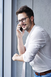 Portrait of businessman on the phone - ABIF00665