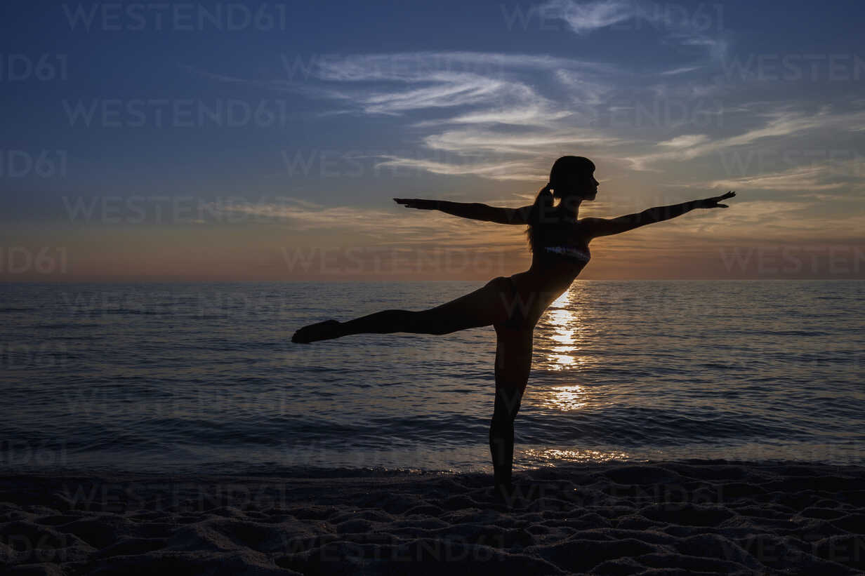 Yoga mukhaasana pose black silhouette on sunset Vector Image