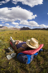 Woman backpacking in Fridgid Air Pass, West Elk Mountains, Colorado, USA - ISF14859