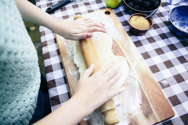 Girl rolling pastry - CUF37921