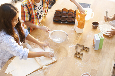 Children making dough in kitchen - CUF38007