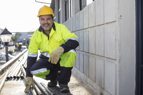 South Africa, Cape Town, Builder with pipes stock photo