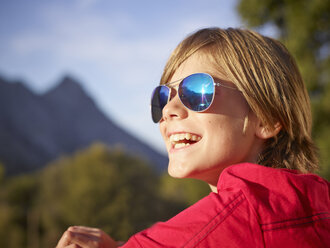 Close up portrait of boy in landscape, Majorca, Spain - CUF38104