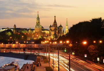 View of Kremlin towers, Saint Basils Cathedral and city highway at night, Moscow, Russia - CUF38466