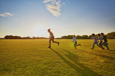 Family enjoying outdoor activities in the park - CUF38549