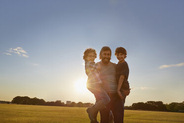 Father and sons out in the park - CUF38550