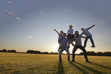 Family enjoying outdoor activities in the park - CUF38552